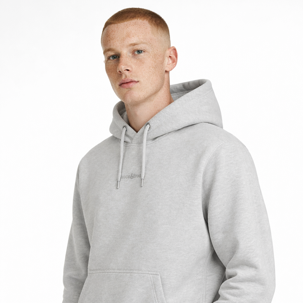 Angled view of Daub Hoody in light grey worn by model by Sauce & Brown