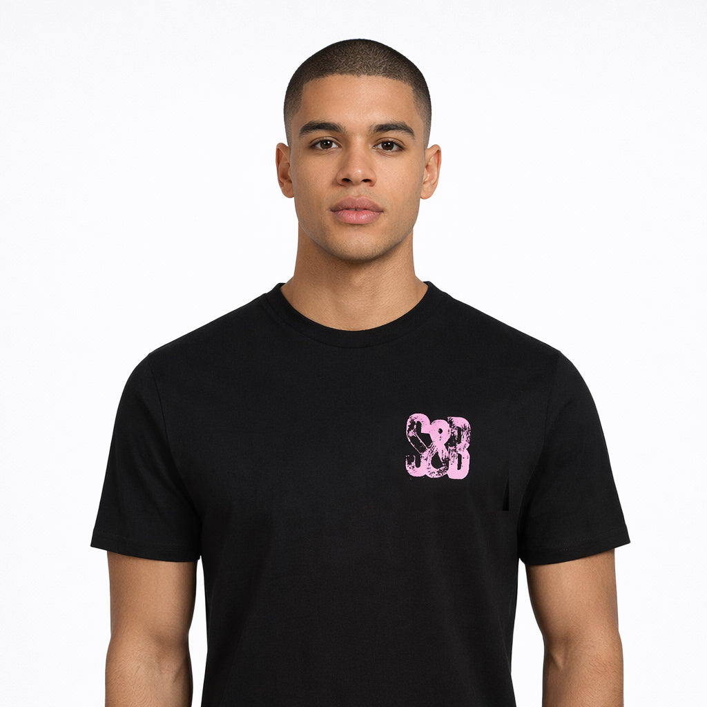 Lilac Press Tee in black with lilac chest logo worn by model by Sauce & Brown