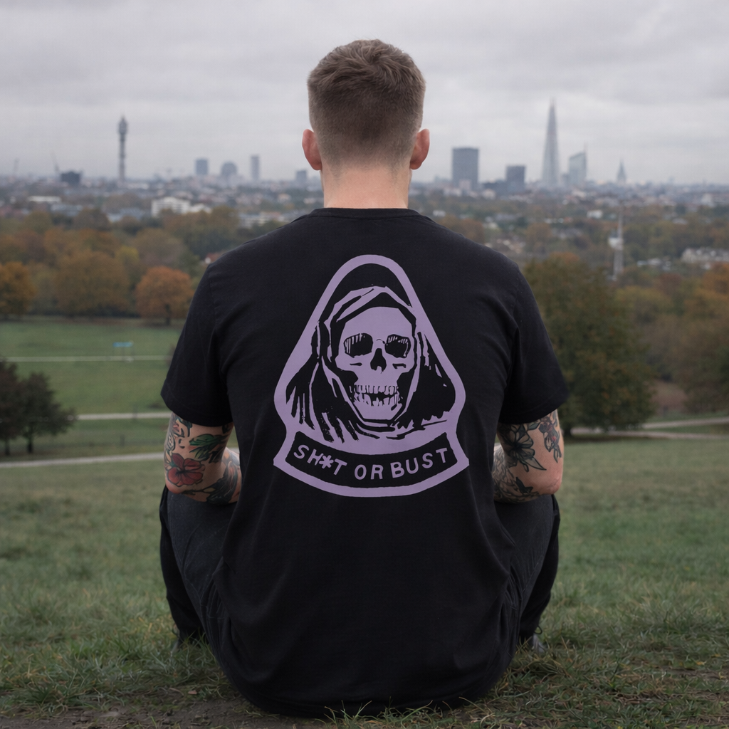 Model wearing Fear City T-Shirt in black with lilac back graphic outdoors by Sauce & Brown